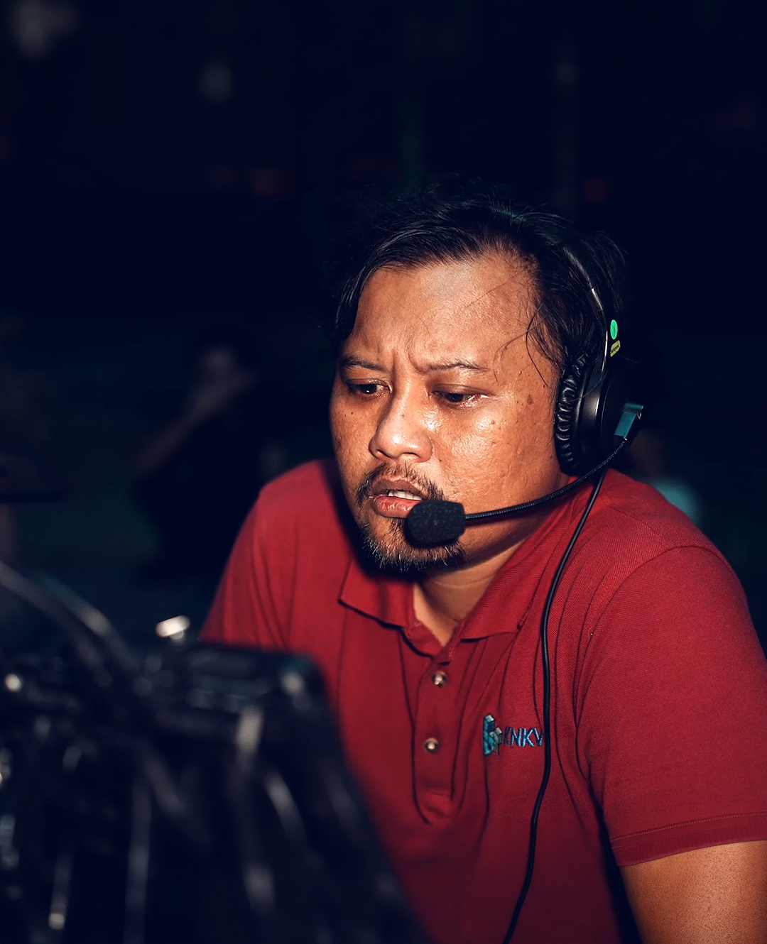 Wan Utama wearing a production headset
