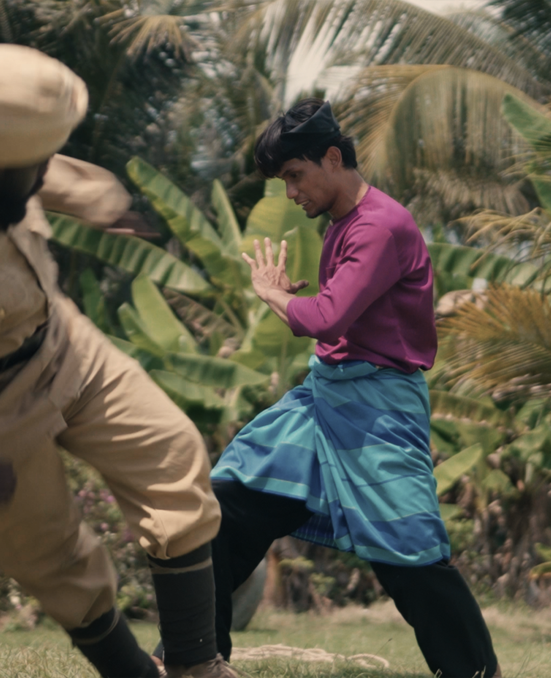 Silat action scene in a tropical setting